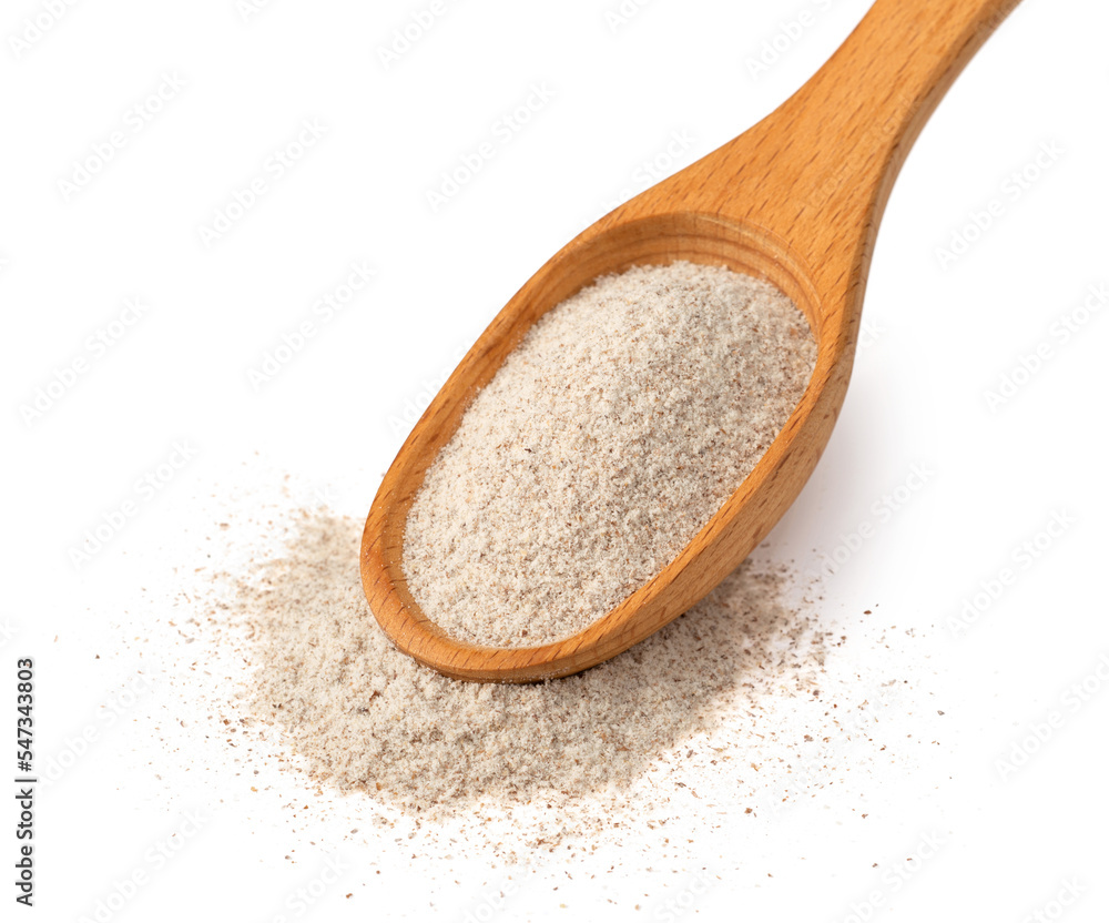 Raw rye flour in the wooden spoon, isolated on white background. Raw rye flour in the wooden spoon, isolated on white background.