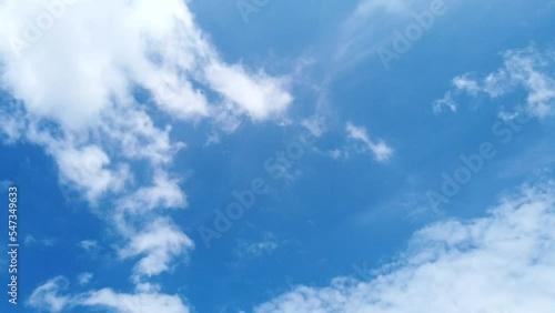 Time lapse blue sky and white fluffy and beautiful cumulus clouds like a cotton against a freedom motion on blue sky in daytime  nature cloudscape background summer season hight view 