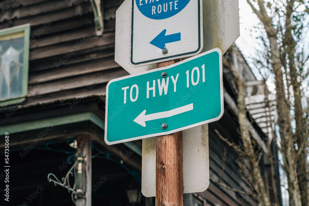 road sign to highway 101 next a evacuation Route sign road sign to highway 101 next a evacuation Route sign