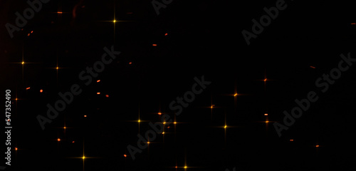 Sparks from the flame on a black background.