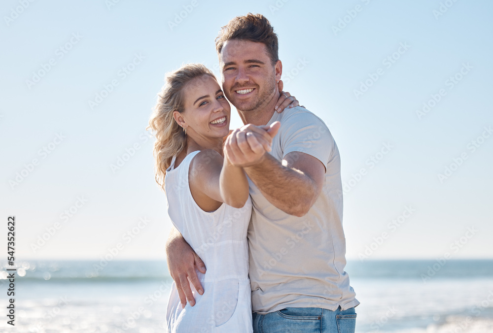 Couple, portrait smile and hug on the beach for love, care or romantic bonding together in the outdoors. Happy man and woman smiling in happiness for summer vacation or relationship romance by ocean Couple, portrait smile and hug on the beach for love, care or romantic bonding together in the outdoors. Happy man and woman smiling in happiness for summer vacation or relationship romance by ocean