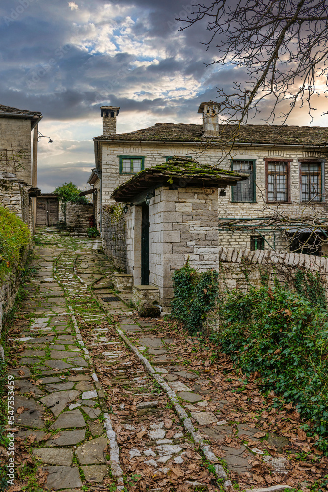 The picturesque village of Dilofo during fall season with its architectural traditional old stone  buildings located on Tymfi mount, Zagori, Epirus, Greece, Europe