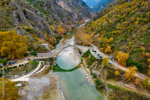 Aerial view of the stone bridge of Konitsa over Aoos river with automn colors , in Zagori, Epirus, Greece.