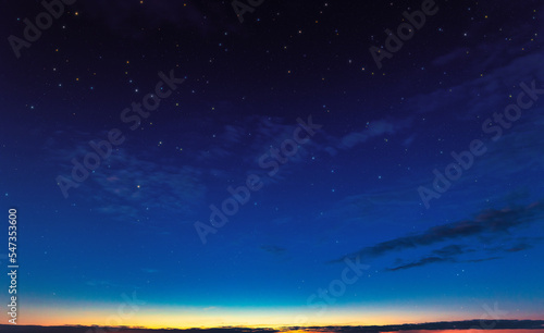 evening sky, day turns to night. Sunset, clouds and starry sky. © maykal