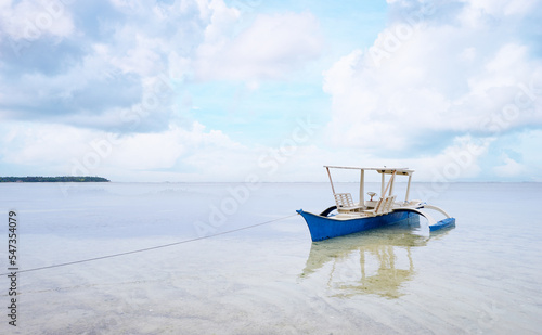 Seascape with philippines traditional fishing boat. © luengo_ua