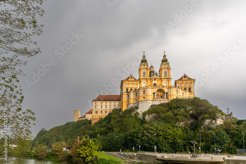 the historic Melk Abbey and church spires on the rocky promontory above the Danube River