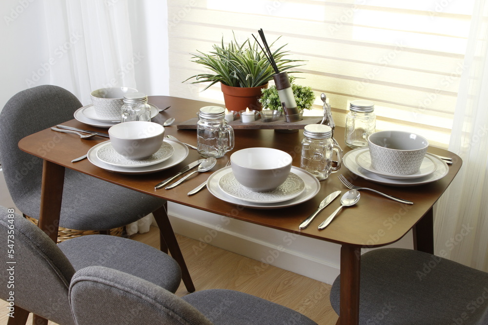 Proper table setting on a small wood table Proper table setting on a small wood table