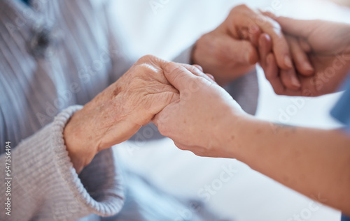 Elderly woman hands, support and holding healthcare worker for medical care or help walking. Retirement care, senior person and holding hands for volunteer caregiver service in health community photo