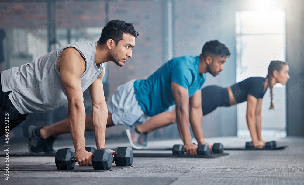 Gym, dumbbell plank and people focus on fitness diet, body health goals or performance wellness commitment. Workout motivation, class exercise challenge and athlete team training on sports club floor