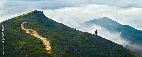  Hiker following the trail on top of mountain range