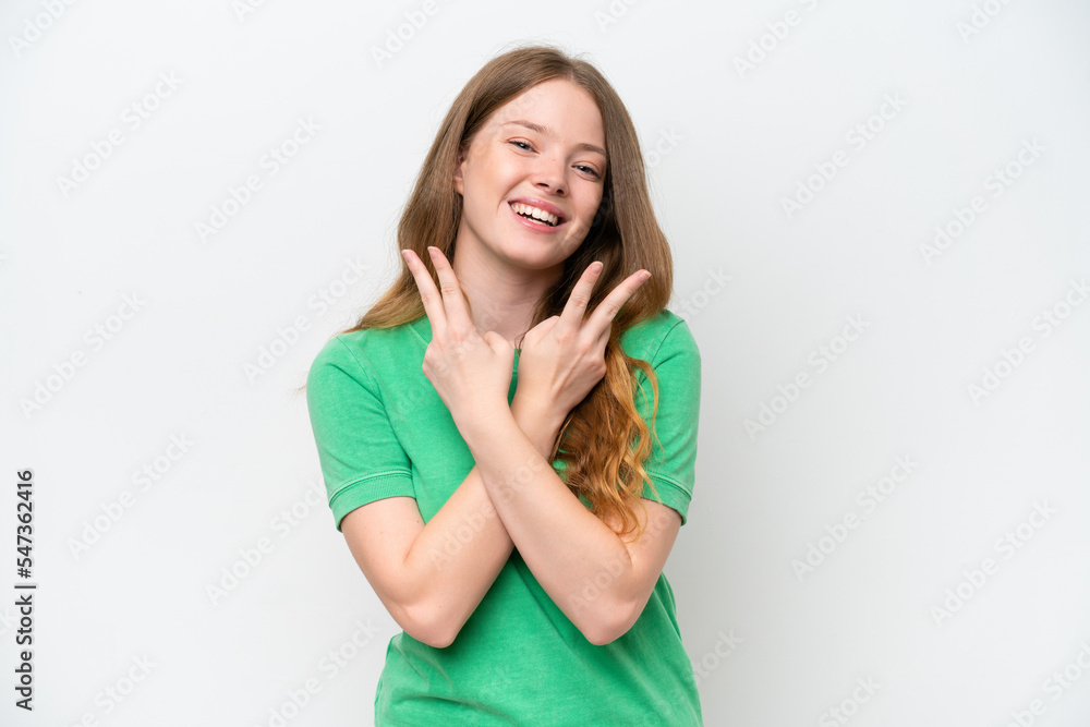 Young pretty woman isolated on white background smiling and showing victory sign Young pretty woman isolated on white background smiling and showing victory sign