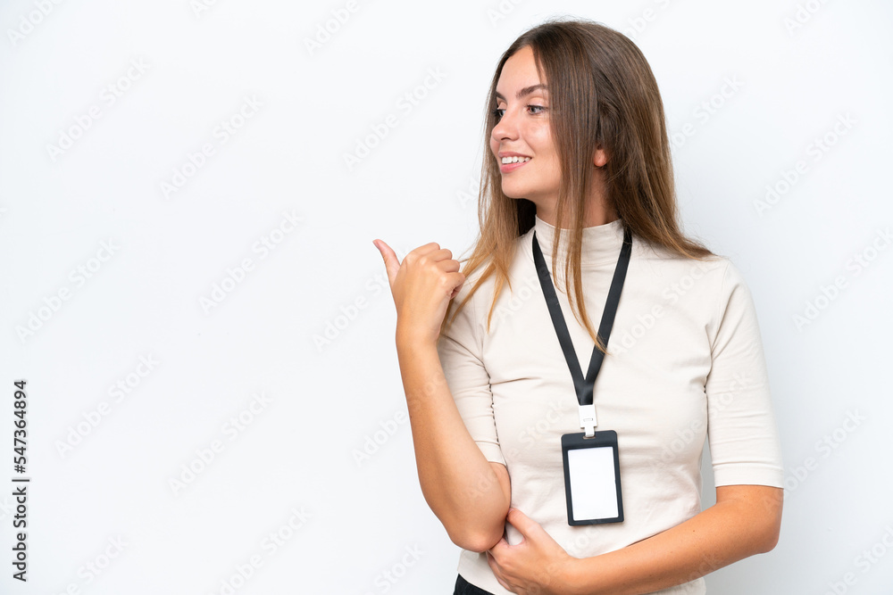 Young pretty woman with ID card isolated on white background pointing to the side to present a product Young pretty woman with ID card isolated on white background pointing to the side to present a product