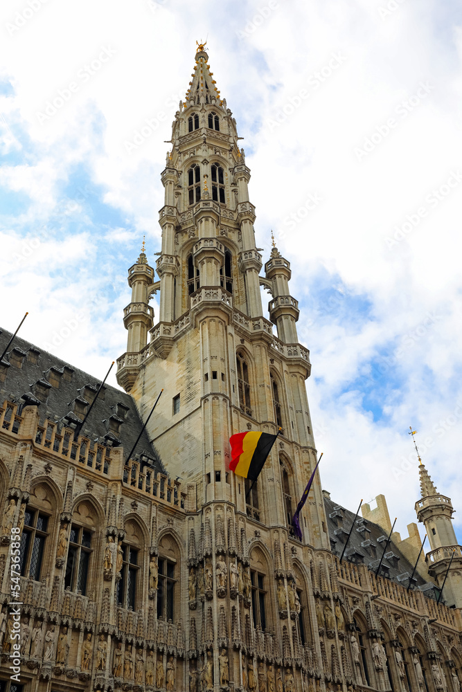 Brussels town hall and the belgian flag in Grand Place
