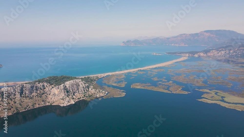 Beautiful seashore. Islands in the distance. Colorful blue sea. The beauty of Turkey. Beautiful rocks and mountains. Sunny clear day. Beautiful water.	