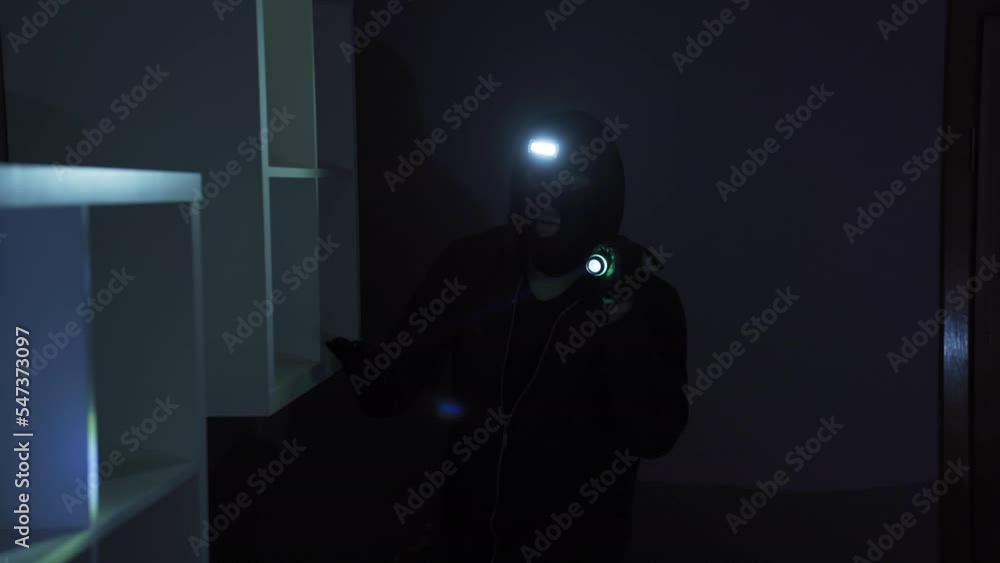 The man who broke into the house is looking for valuables with a flashlight.
The thief man who robbed the house.
The man who broke into the house is looking for valuables with a flashlight.
The thief man who robbed the house.