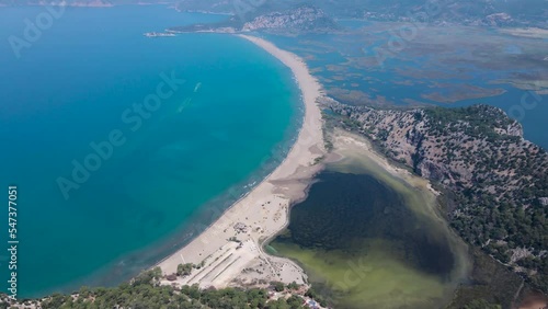 Beautiful seashore. Islands in the distance. Colorful blue sea. The beauty of Turkey. Beautiful rocks and mountains. Sunny clear day. Beautiful water.