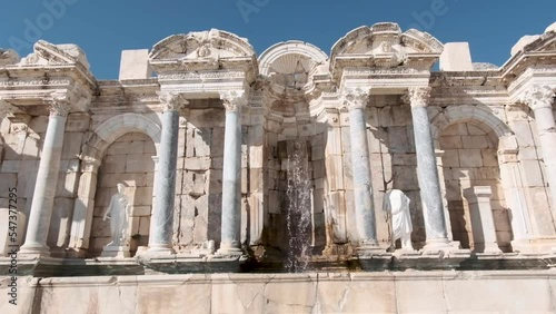 walking away backwards from antonine fountain at sagalassos ancient city, burdur, turkey
