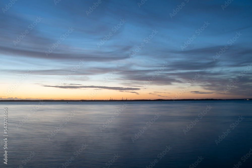 Sunset over the solent with calm summer seas and still waters