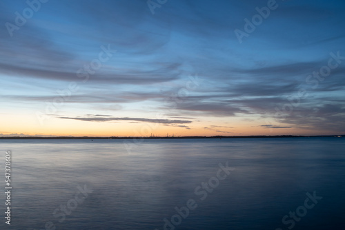 Sunset over the solent with calm summer seas and still waters