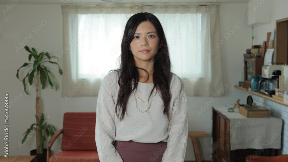 Beautiful Japanese woman opens her eyes and stares the camera. Emotionless, Still, Protest. Living room. 25P Beautiful Japanese woman opens her eyes and stares the camera. Emotionless, Still, Protest. Living room. 25P