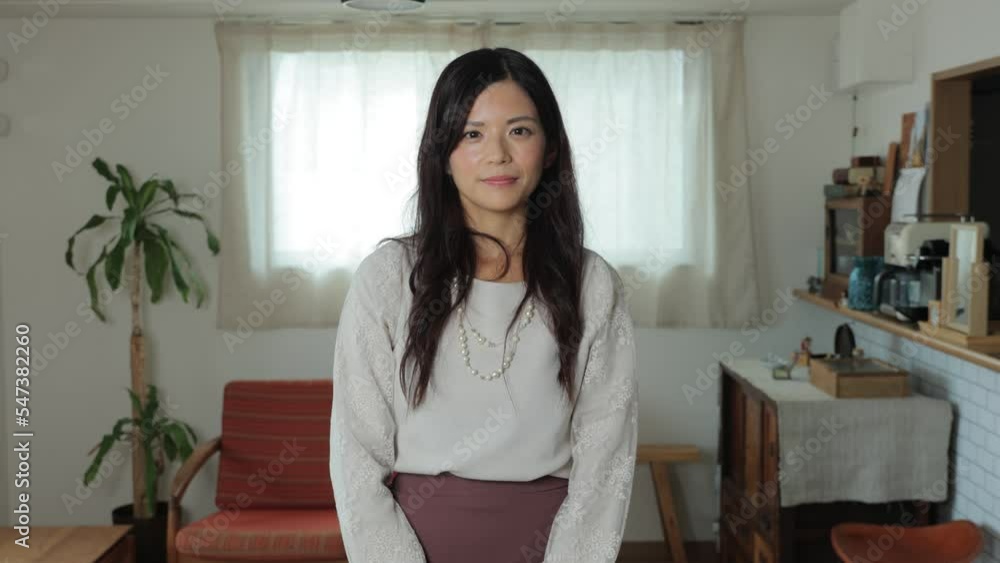 Asian beautiful woman smiles at the camera. Happy, Joy, Delighted. Living room. Asian beautiful woman smiles at the camera. Happy, Joy, Delighted. Living room.
