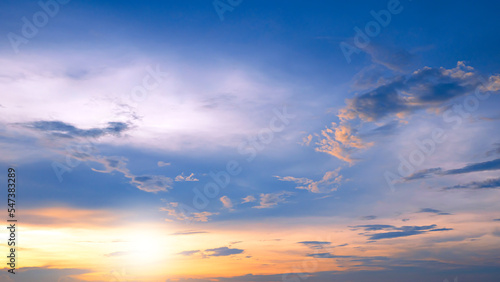 Fototapeta Naklejka Na Ścianę i Meble -  Sunset sky clouds with yellow sunlight on blue sky background in evening time