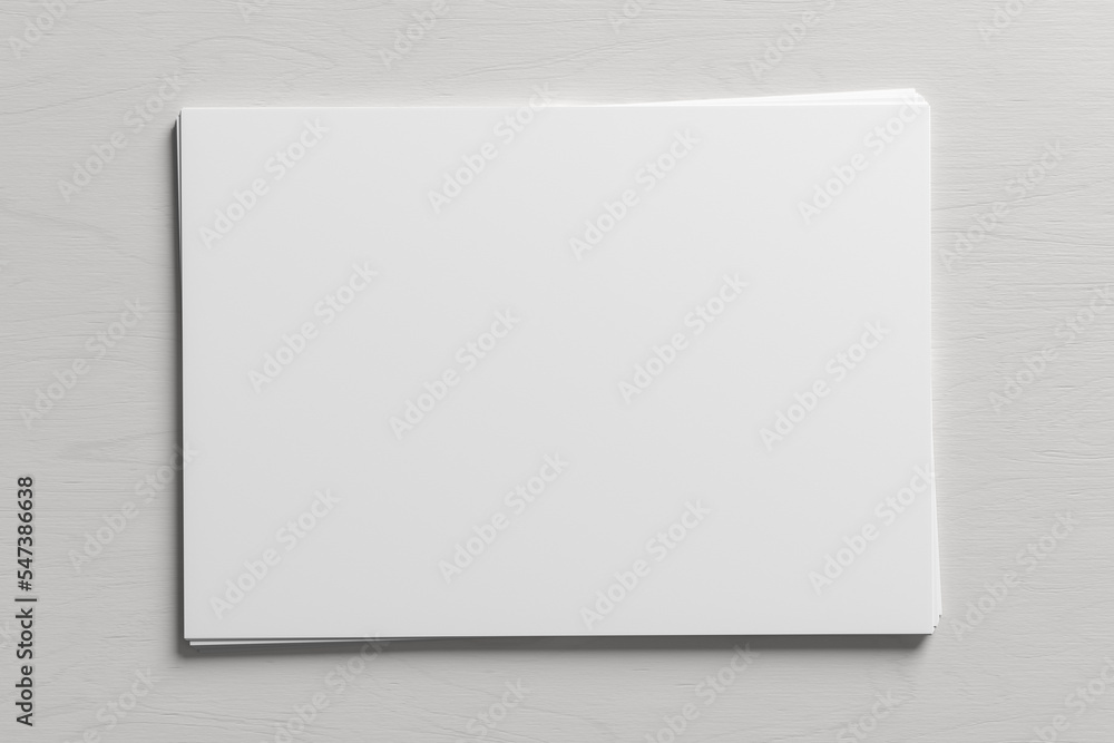 Stack of paper mockup on the white wooden table. Stack of paper mockup on the white wooden table.