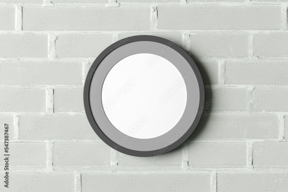 Dark wooden round frame poster mock up on the white brick wall. Dark wooden round frame poster mock up on the white brick wall.