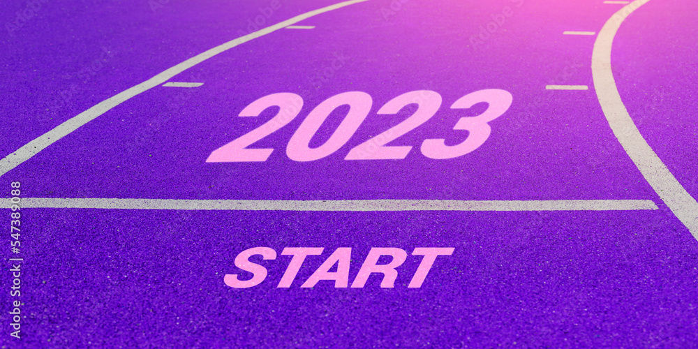 Fototapeta premium New year 2023. Words START and 2023 written on run track. The beginning of the new year. Changing lives in the new year