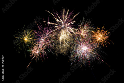 Colored fireworks on black background copy space