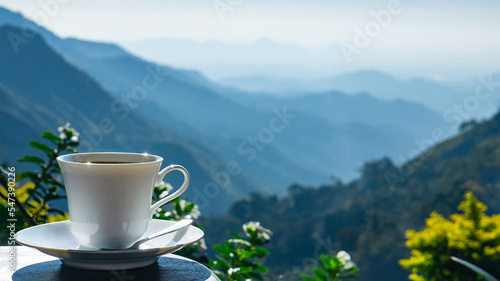 Сup of coffee on the mountains background