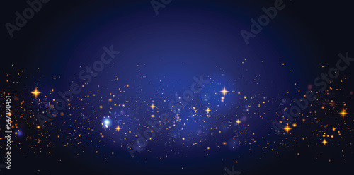 Golden glitter dust sparkles on blue background vector.