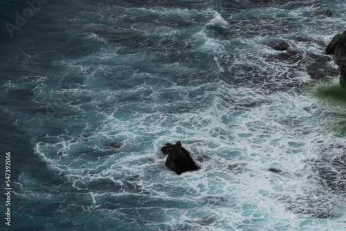 Wallpaper Mural The waves of the ocean water meet with underwater pointed rocks Torontodigital.ca