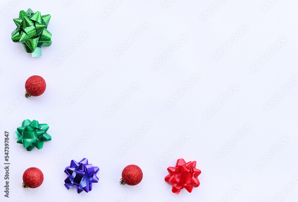 Background for the New Year, Christmas decor on a white background. Christmas balls and bows, top view