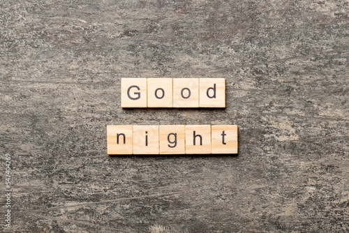 good night word written on wood block. good night text on table, concept photo