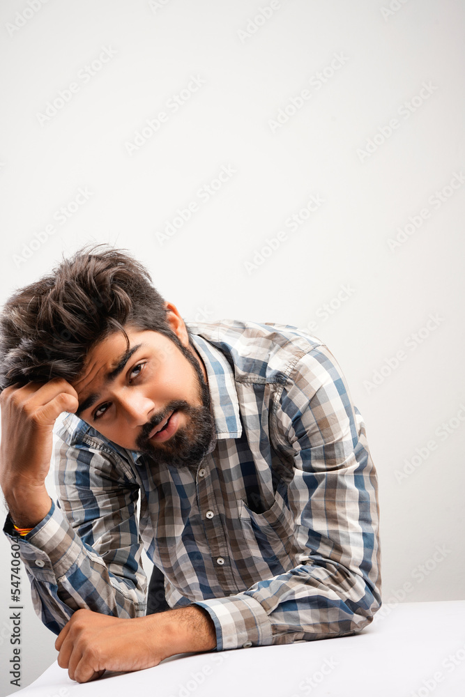 young hispanic bearded man wearing plaid shirt over white background with positive expression, has broad interested smile. Look there, please.looking for something or found something young hispanic bearded man wearing plaid shirt over white background with positive expression, has broad interested smile. Look there, please.looking for something or found something