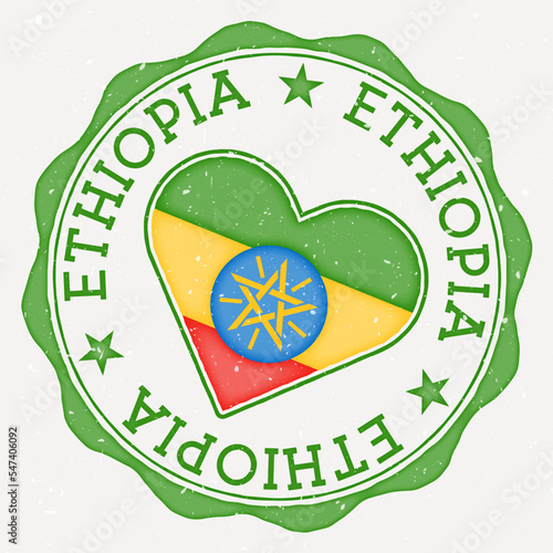 Ethiopia heart flag logo. Country name text around Ethiopia flag in a shape of heart. Vibrant vector illustration.