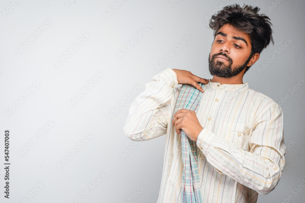 Portrait of an happy Indian farmer in rural India concept. Standing in the white background Portrait of an happy Indian farmer in rural India concept. Standing in the white background