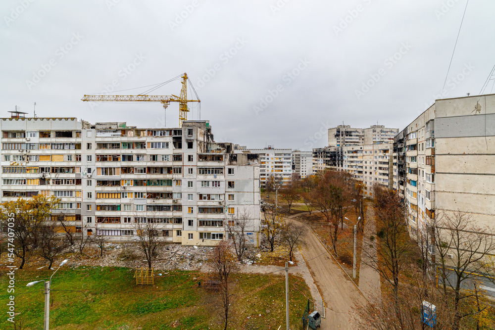 Residential area Saltovka, Kharkiv, Ukraine - autumn 2022: Repair of destroyed multi-storey buildings. Destruction of civil infrastructure. War crimes. War in Ukraine.