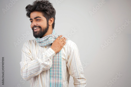 Portrait of an happy Indian farmer in rural India concept. Standing in the white background