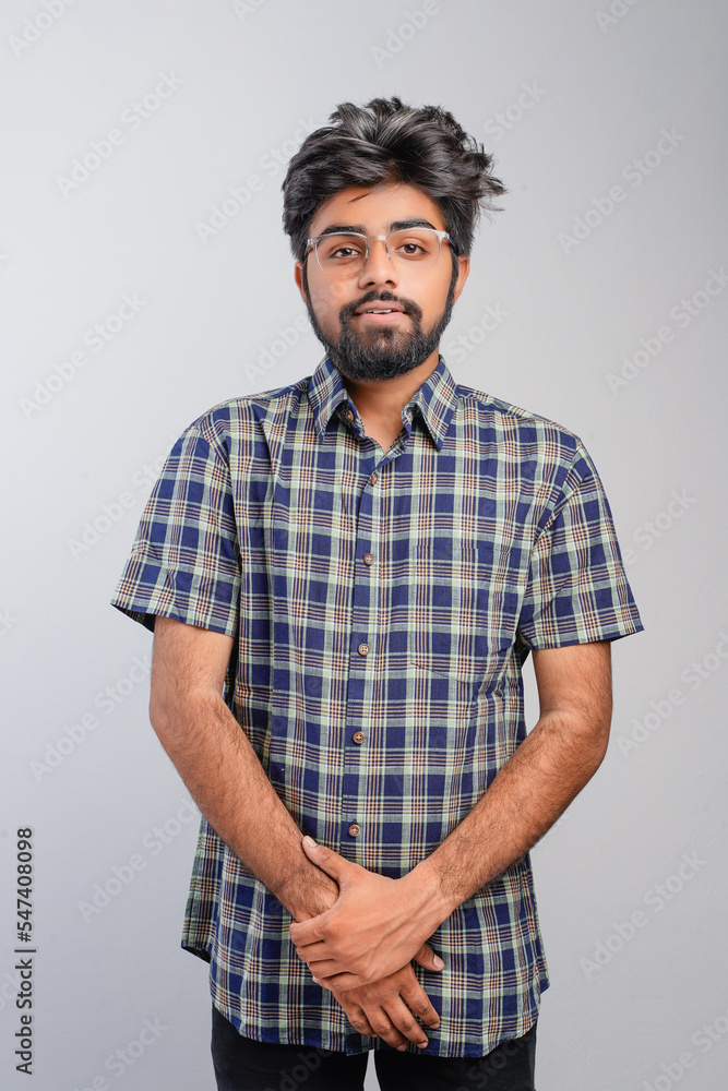 Young Indian businessman against white background Young Indian businessman against white background