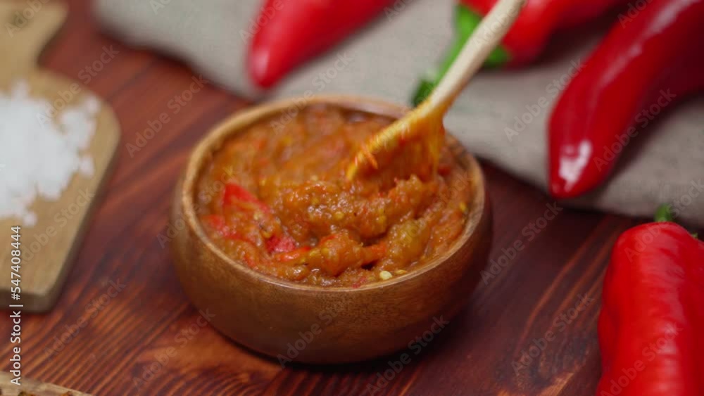 Balkan sauce ajvar and ingredients for its preparation. Serbian traditional food. Selective focus Balkan sauce ajvar and ingredients for its preparation. Serbian traditional food. Selective focus