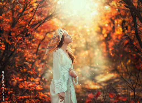 Fantasy portrait girl princess teenager enjoys nature with white bird barn owl on shoulder. Eyes closed pretty face enjoying nature, magical divine sun light. Autumn nature forest trees. vintage dress