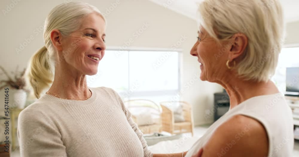 Happy, friends and hug with a senior woman and friend hugging during a visit in a home living room. Smile, affection and relationship with a female and acquaintance embracing while bonding together Happy, friends and hug with a senior woman and friend hugging during a visit in a home living room. Smile, affection and relationship with a female and acquaintance embracing while bonding together