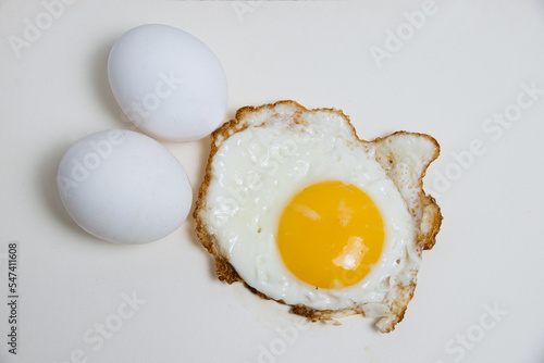 Fried egg and boiled eggs isolate on white background. Concept of healthy eating photo