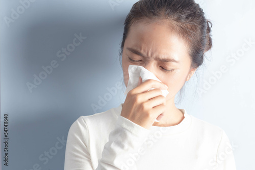 Sick Asian woman, seasonal health problems, chronic allergic rhinitis, respiratory tract infection, copy space