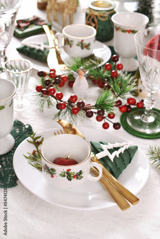 Christmas table setting in white green red colors Christmas table setting in white green red colors