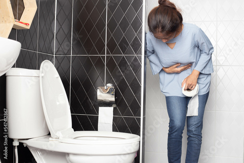 Quadro em tela Young woman with diarrhea, diarrhea, frequent defecation