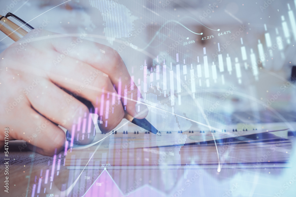 Double exposure of man doing notes of stock market with forex graph. Double exposure of man doing notes of stock market with forex graph.