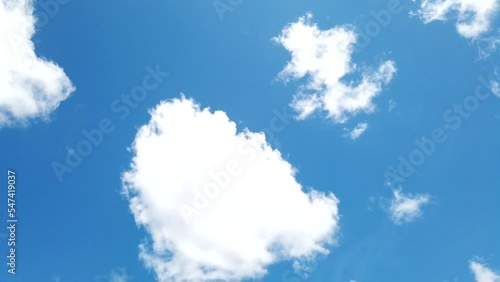 Time lapse blue sky and white fluffy and beautiful cumulus clouds like a cotton against a freedom motion tranform to many shape on blue sky in daytime  nature cloudscape background summer season 